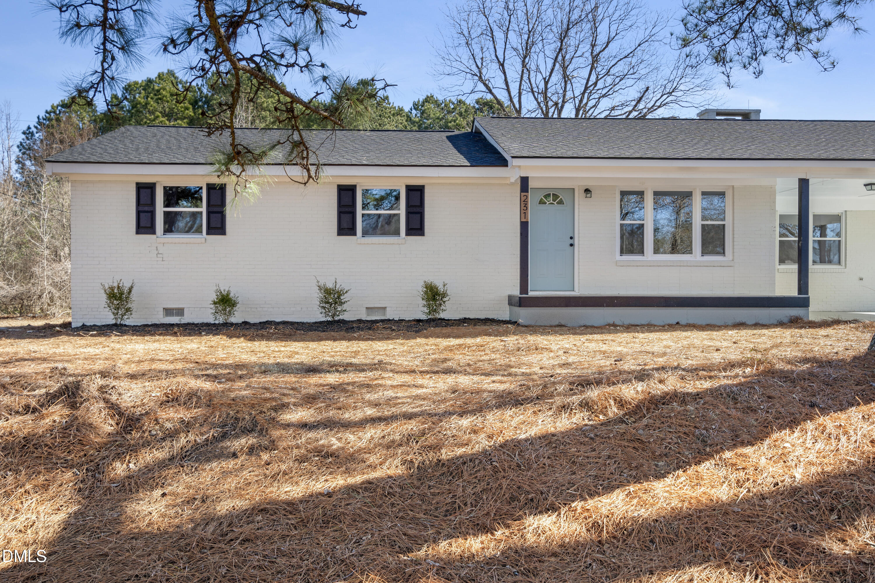 231 Faith Church Road Four Oaks, NC 27524 - Photo 2 of 47 a view of a house with backyard
