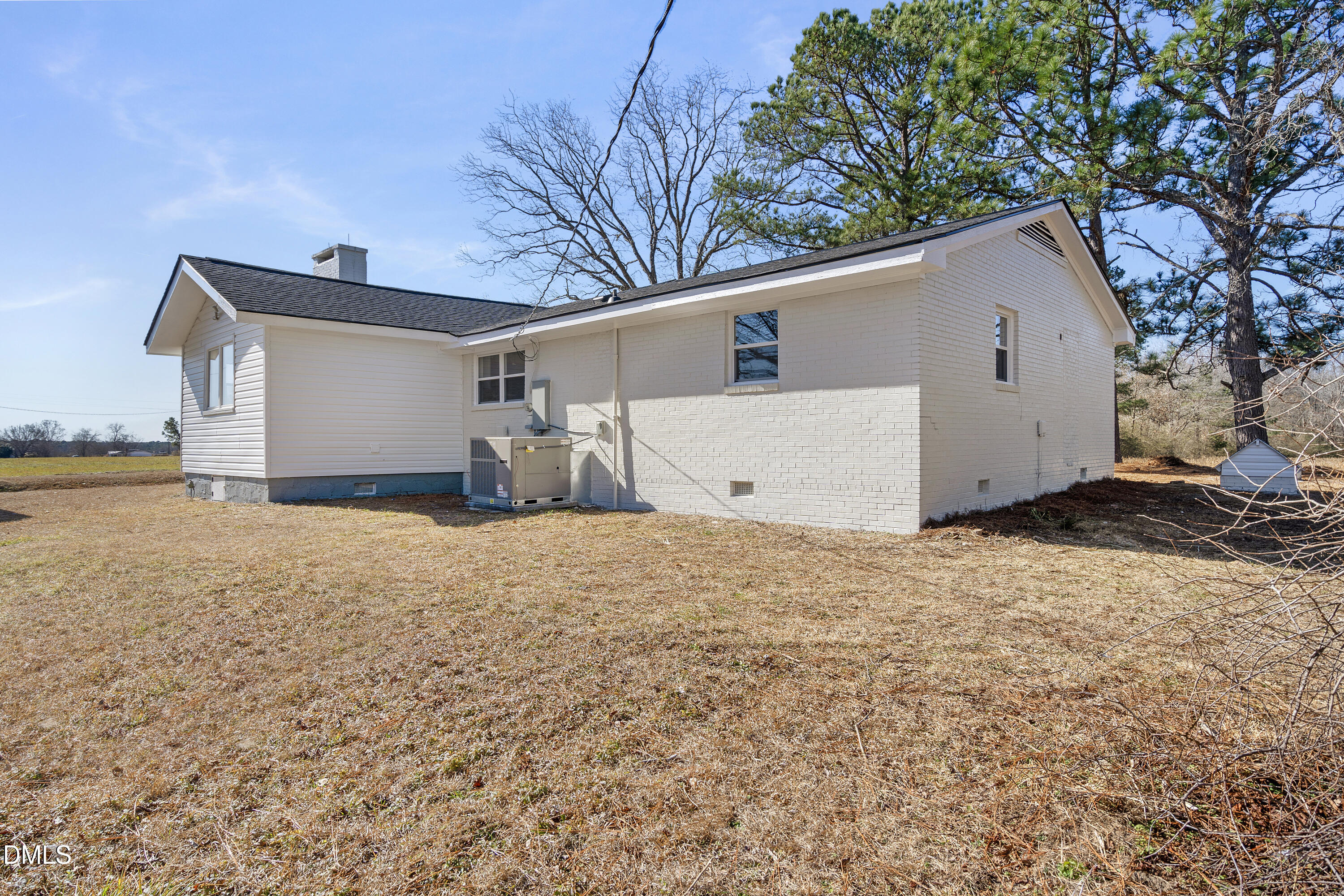 231 Faith Church Road Four Oaks, NC 27524 - Photo 44 of 47 a view of a house with a yard and garage