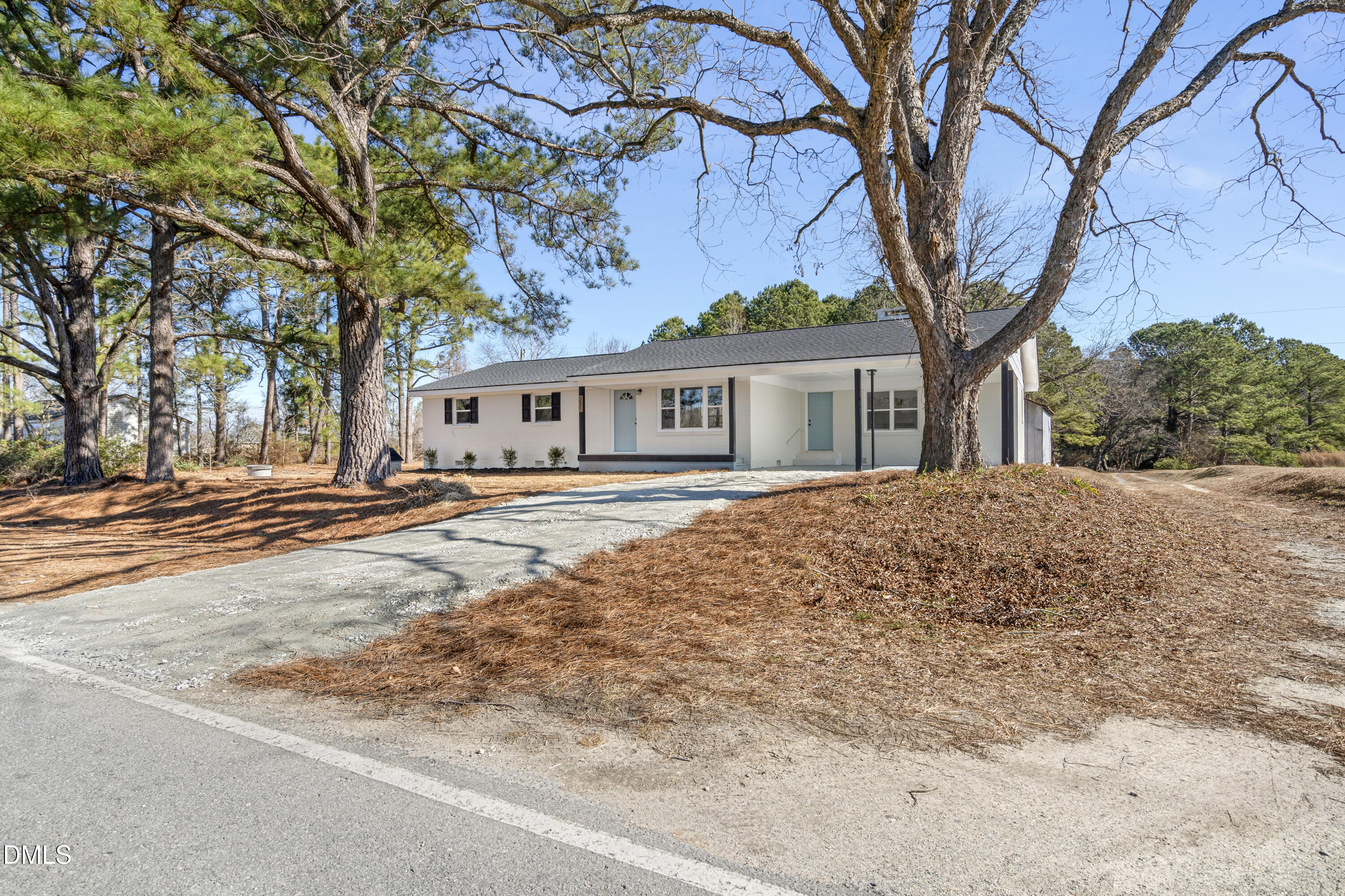 231 Faith Church Road Four Oaks, NC 27524 - Photo 6 of 47 front view of house with a trees