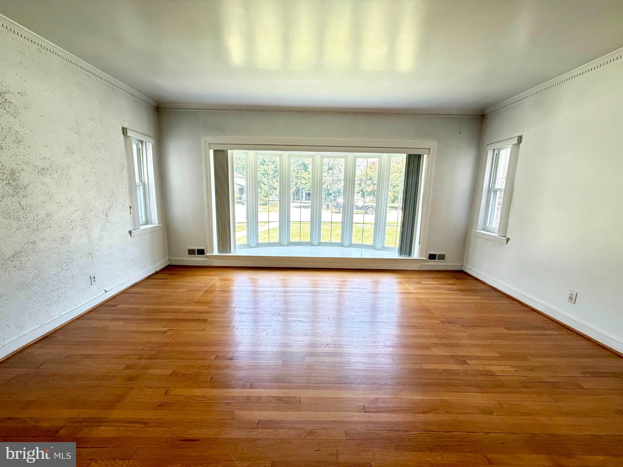 6318 Winner Avenue Baltimore, MD 21215 - Photo 11 of 75 wooden floor in an empty room with a window