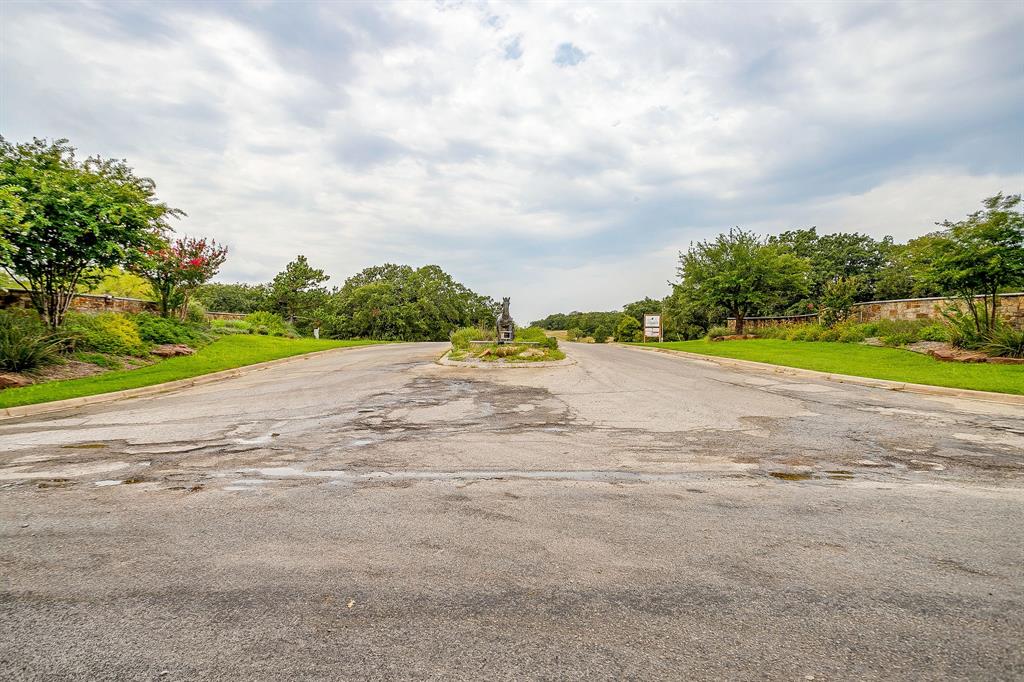 205 Pheasant Run Court Sunset, TX 76270 - Photo 11 of 28 a view of a road with a yard