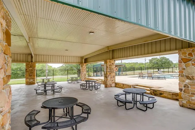 a view of house with outdoor space and swimming pool