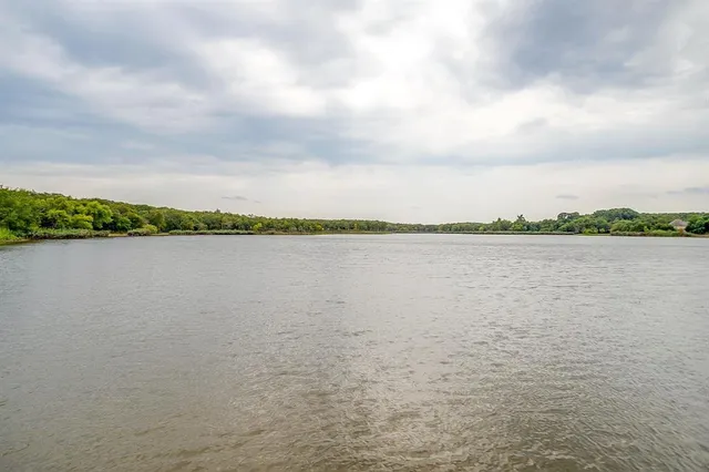 a view of a lake with a big yard