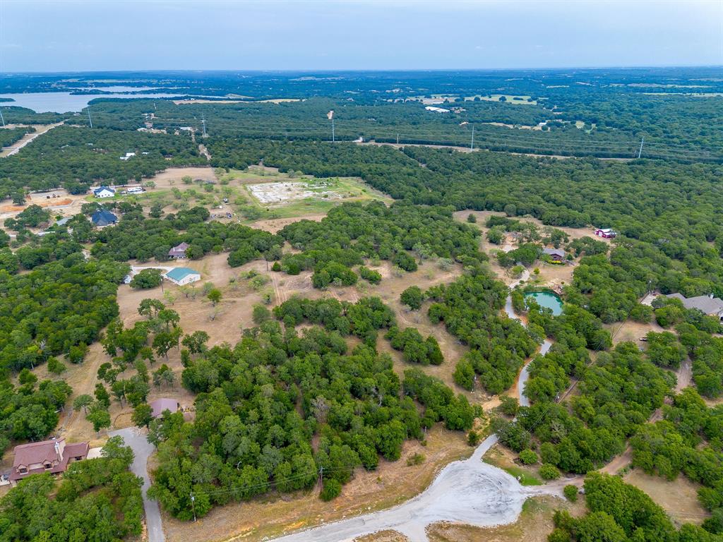 205 Pheasant Run Court Sunset, TX 76270 - Photo 24 of 28 a view of a lake with a city