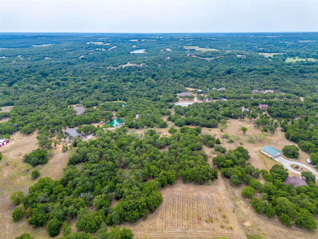 205 Pheasant Run Court Sunset, TX 76270 - Photo 25 of 28 an aerial view of residential house with green space