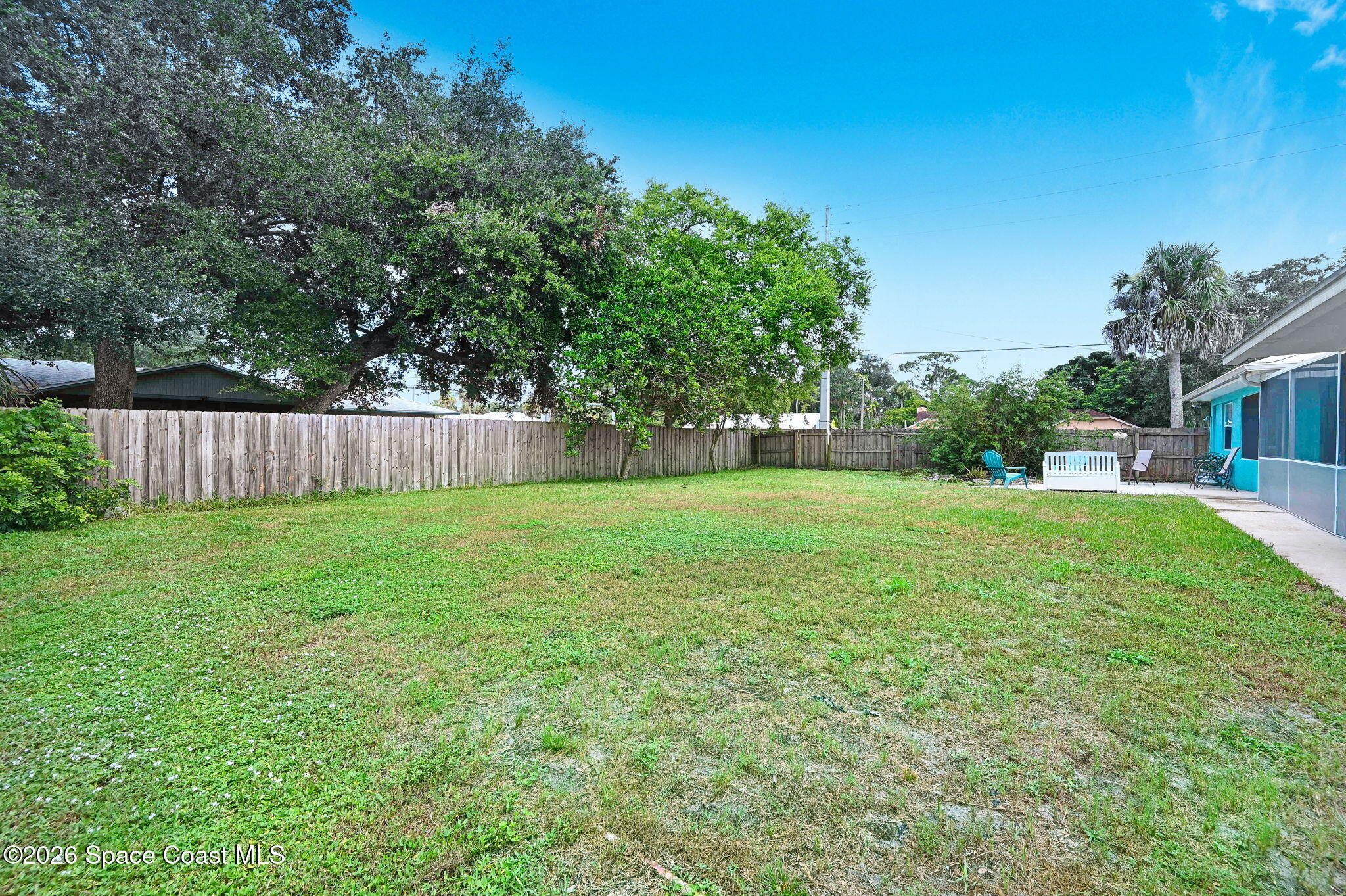 7155 Export Avenue Cocoa, FL 32927 - Photo 27 of 31 a view of a house with backyard and a tree
