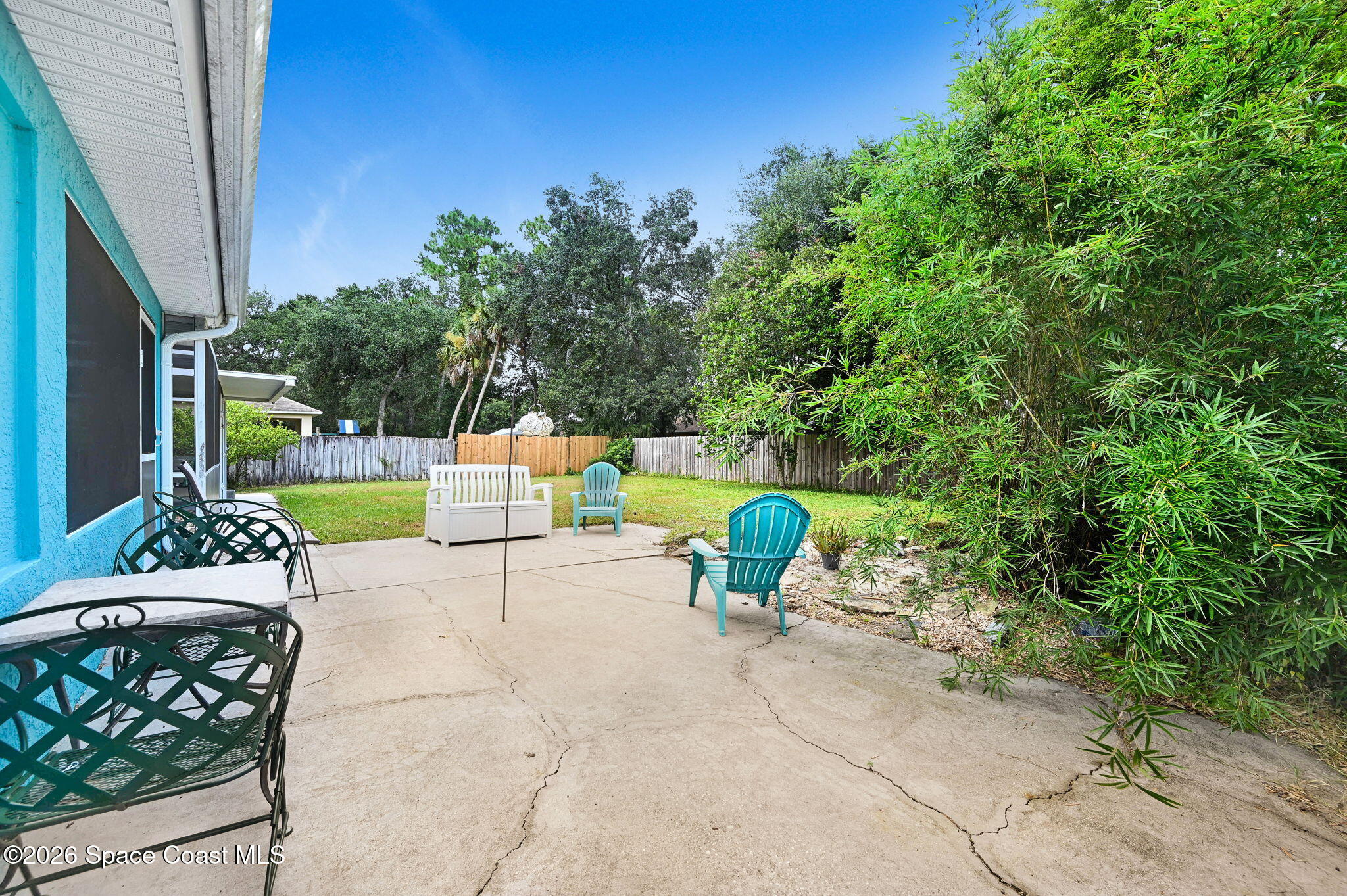 7155 Export Avenue Cocoa, FL 32927 - Photo 28 of 31 a view of a chairs and table in backyard