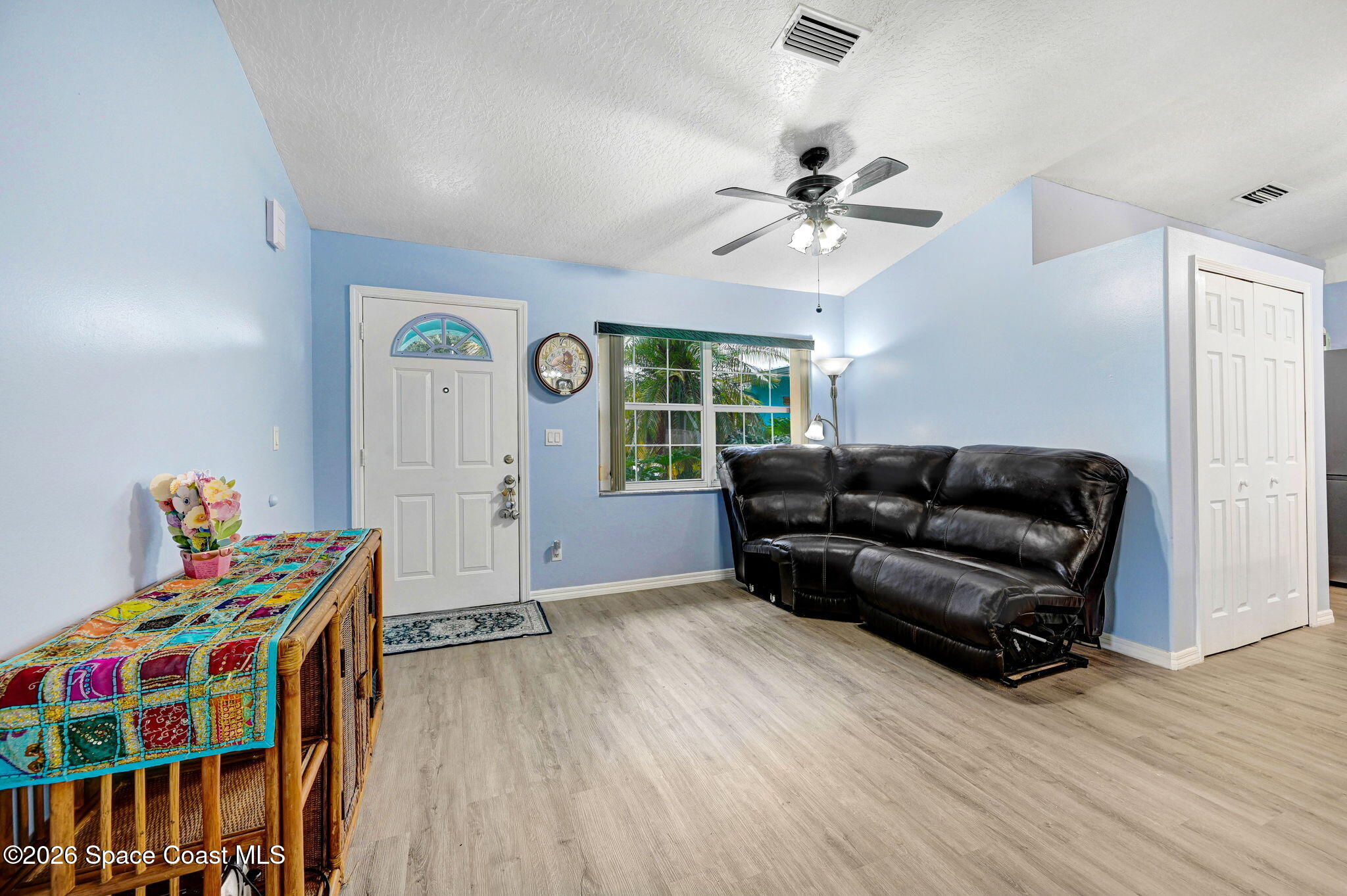 7155 Export Avenue Cocoa, FL 32927 - Photo 6 of 31 a living room with furniture and a wooden floor