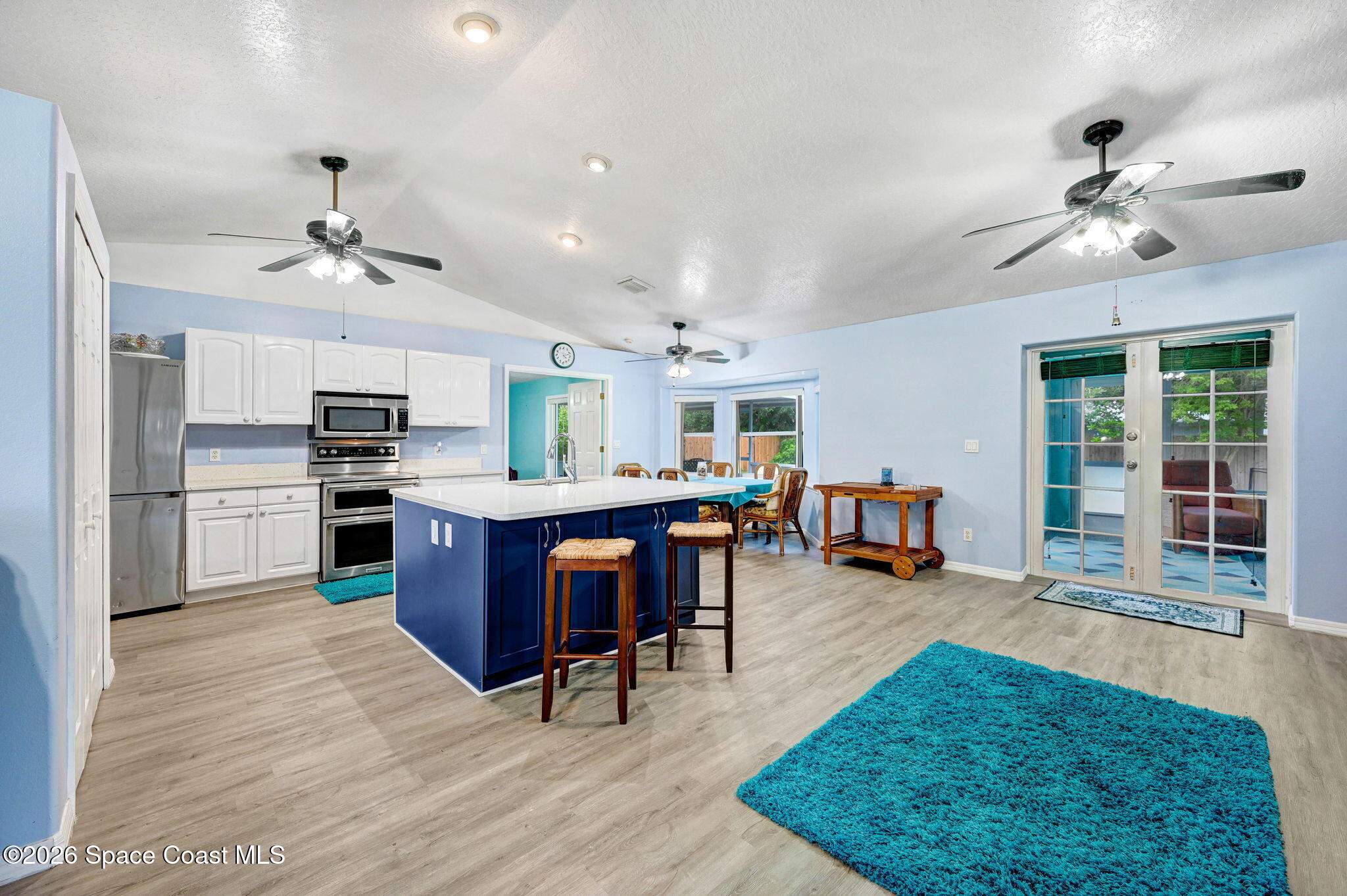 7155 Export Avenue Cocoa, FL 32927 - Photo 8 of 31 a living room with furniture a dining table and kitchen view