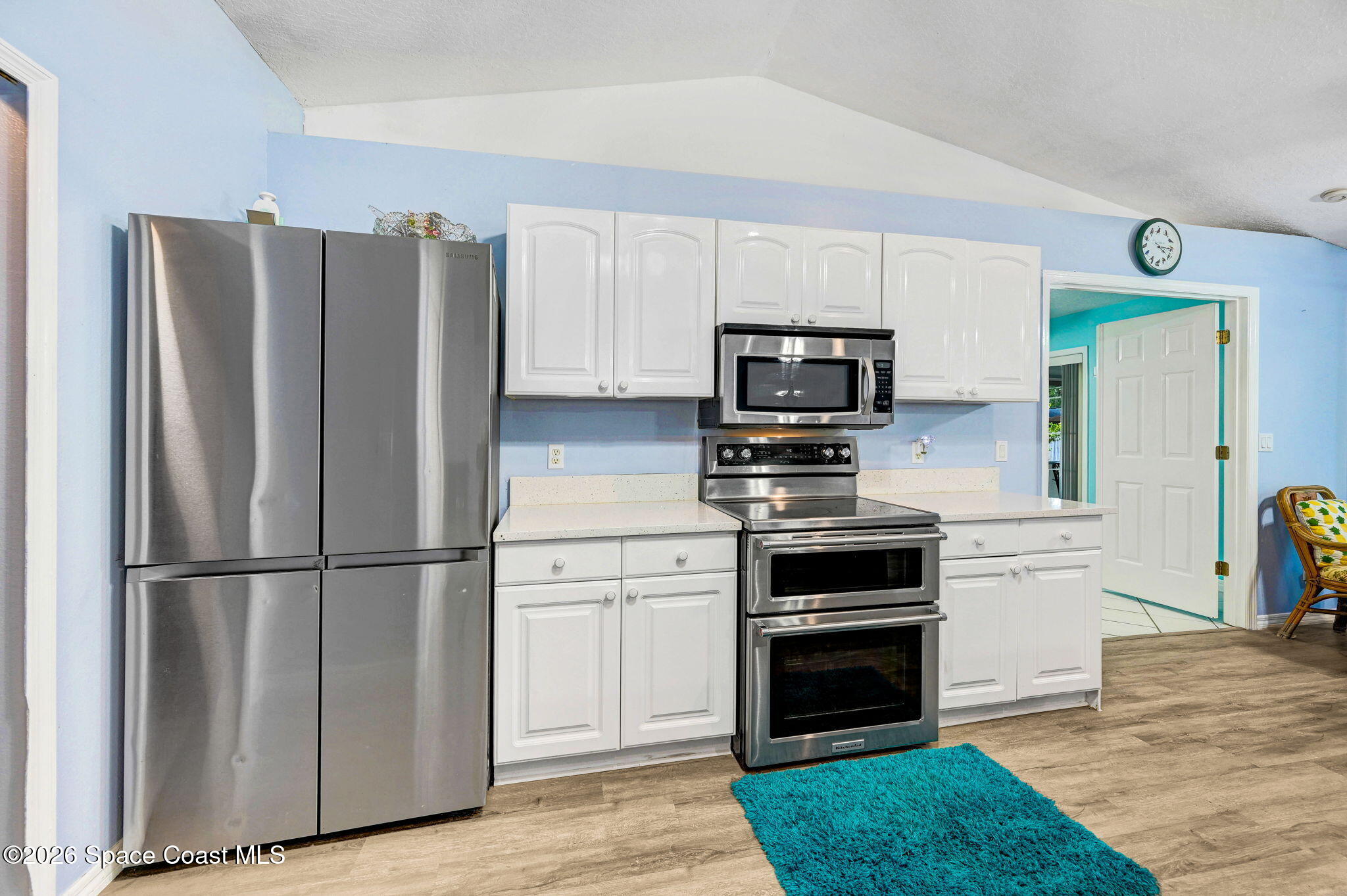 7155 Export Avenue Cocoa, FL 32927 - Photo 9 of 31 a kitchen with a refrigerator stove and microwave