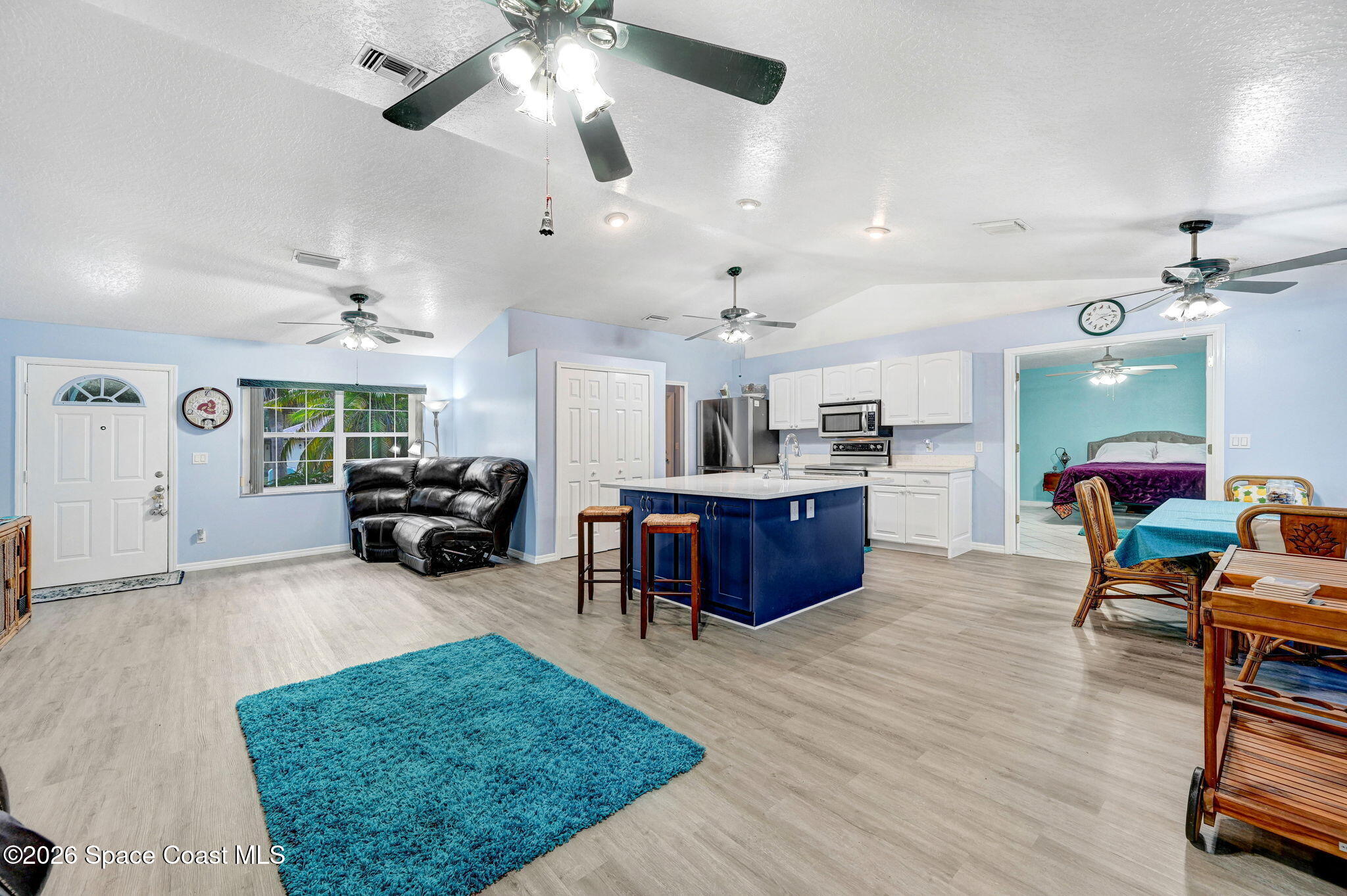 7155 Export Avenue Cocoa, FL 32927 - Photo 31 of 31 a living room with furniture kitchen view and a chandelier