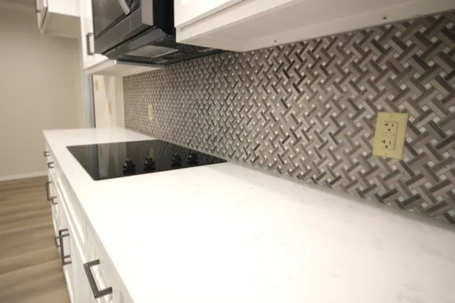 a spacious bathroom with a toilet sink and mirror