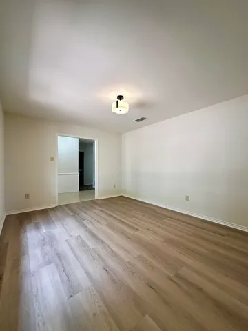 a large kitchen with kitchen island a sink stainless steel appliances and cabinets