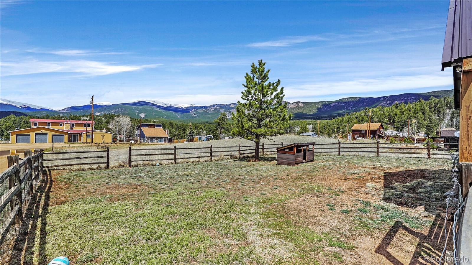 39 Cowan Road Bailey, CO 80421 - Photo 20 of 24 a view of a yard with wooden fence