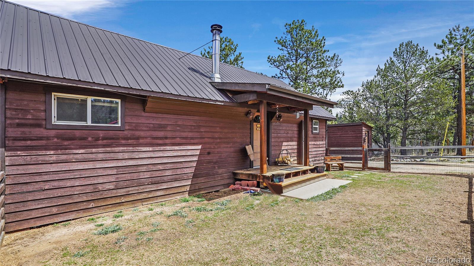 39 Cowan Road Bailey, CO 80421 - Photo 21 of 24 a view of a lounge chair in the backyard
