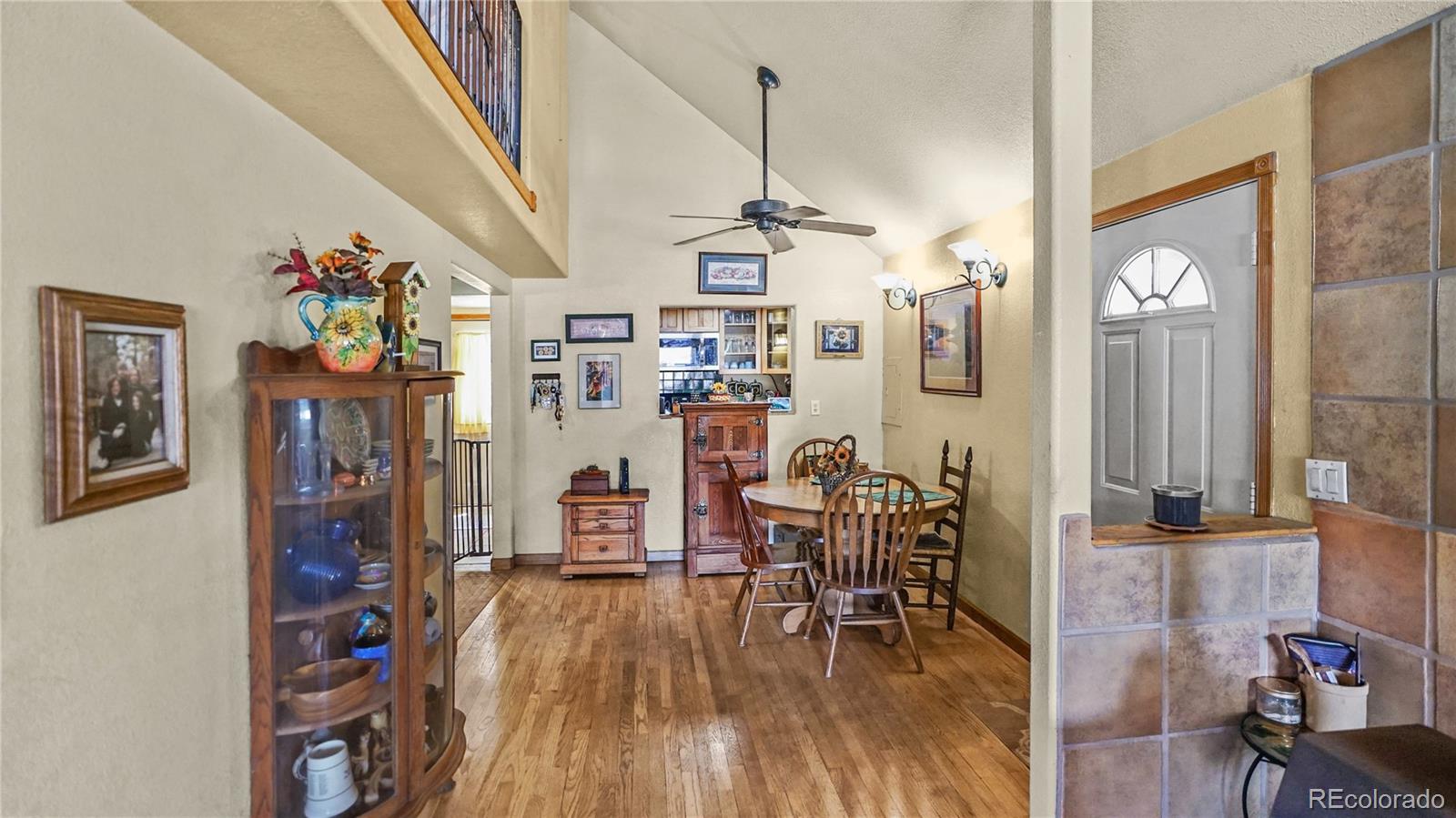 39 Cowan Road Bailey, CO 80421 - Photo 5 of 24 a view of a dining room with furniture wooden floor and a chandelier