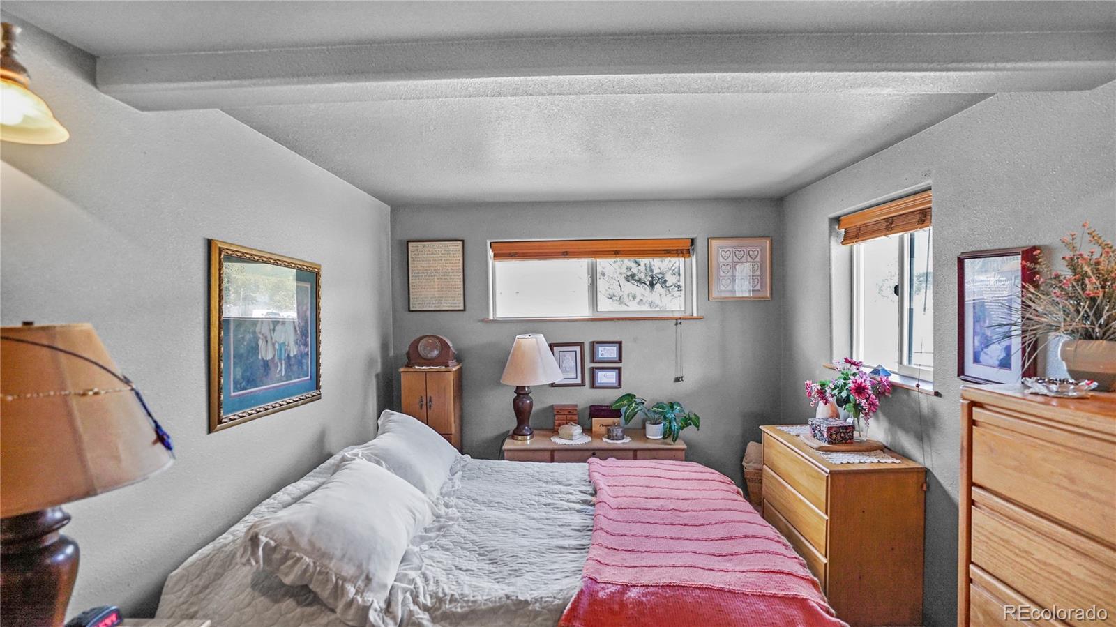 39 Cowan Road Bailey, CO 80421 - Photo 6 of 24 a bed sitting in a bedroom next to a window