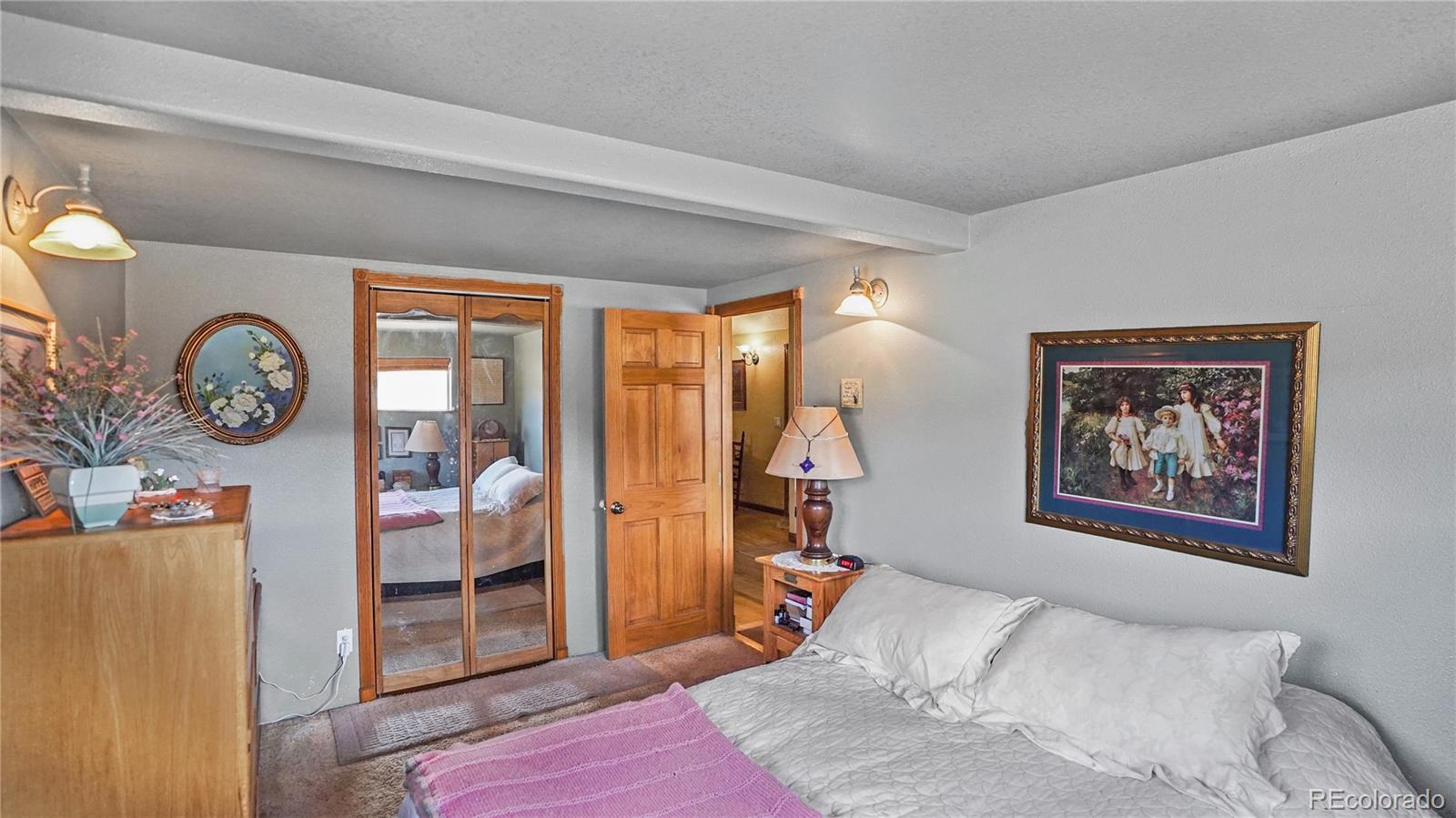 39 Cowan Road Bailey, CO 80421 - Photo 7 of 24 a bedroom with a bed and a window