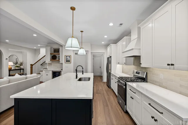 a stove top oven sitting inside of a kitchen