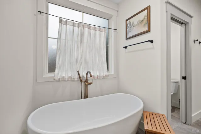 a bathroom with a white bathtub