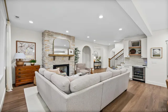 a living room with furniture and a fireplace
