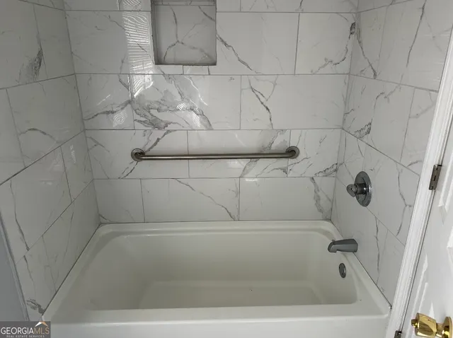 a bathroom with a bathtub