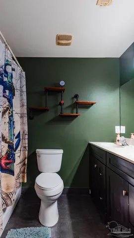 a bathroom with a toilet and a sink