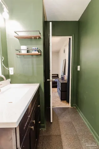 a view of a kitchen cabinets and a wooden floor