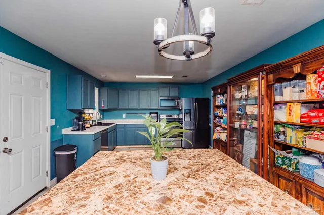 a view of a kitchen and dining room