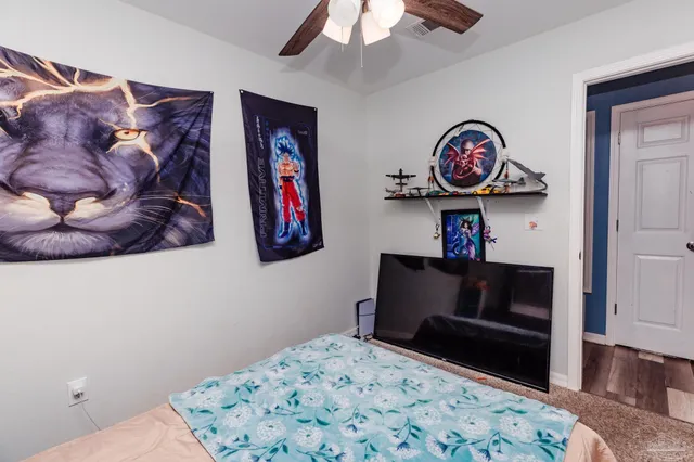 a bedroom with a bed and cabinets