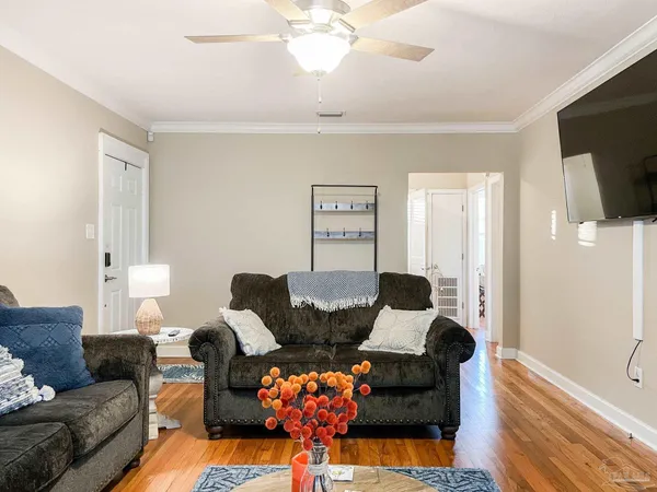 a living room with furniture and a flat screen tv