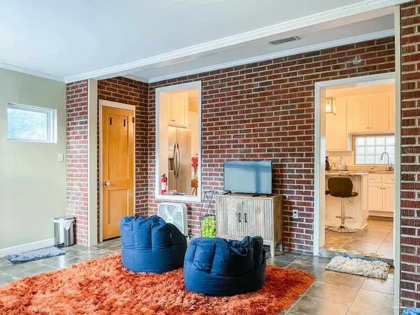 a living room with furniture and a gate