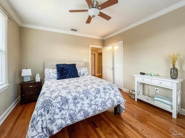 a bedroom with a bed and a dresser