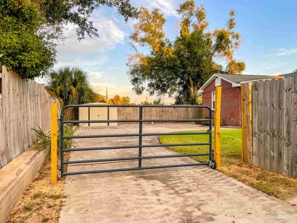a view of a pathway with a yard