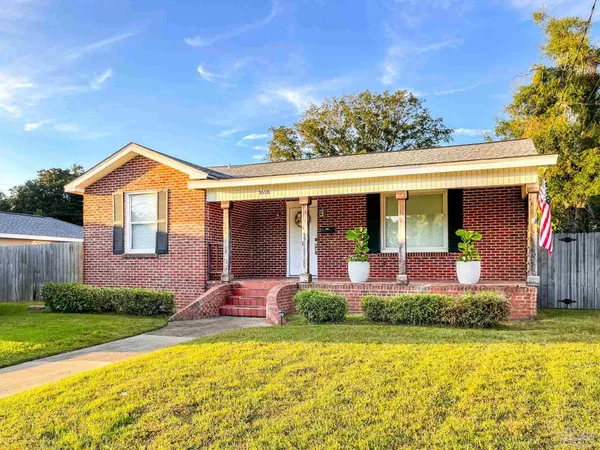 a front view of house with swimming pool and porch