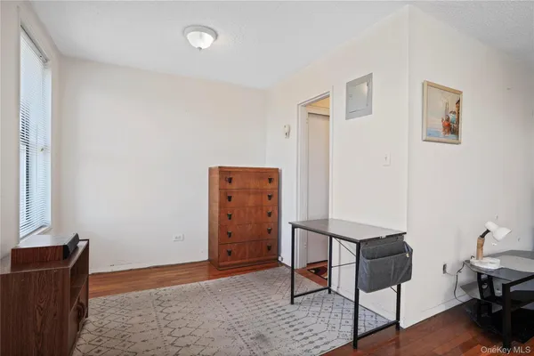 a view of work space with furniture and wooden floor