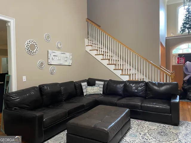 a living room with furniture and a couch