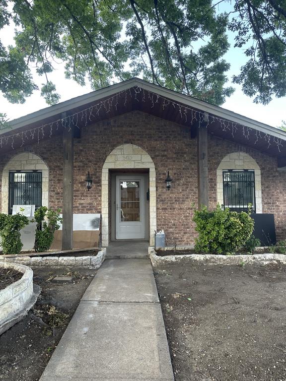 3417 Blue Ridge Lane Garland, TX 75042 - Photo 1 of 9 a front view of a house with a yard