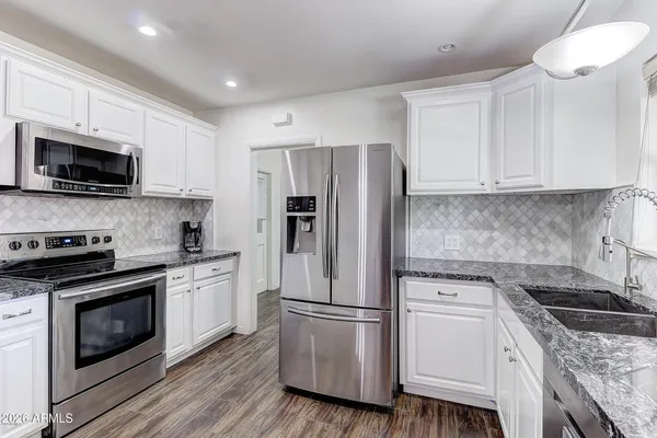 a kitchen with a stove microwave and refrigerator
