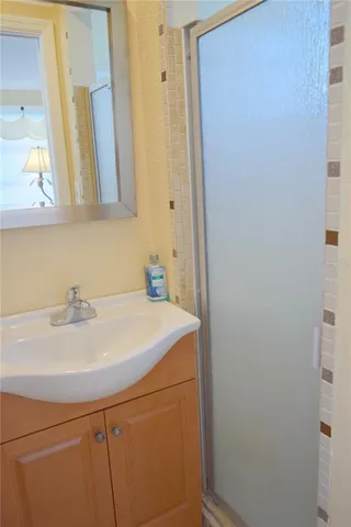 a bathroom with a sink and a mirror