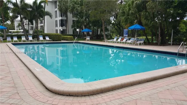a view of a swimming pool with a patio