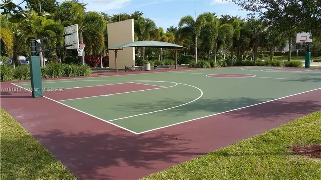 a front view of a house with a yard and green space