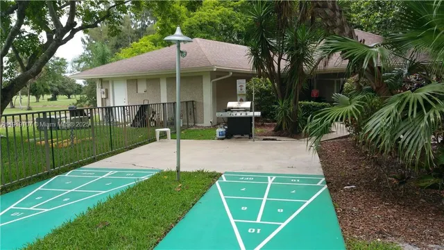 a view of a park with swings and slides