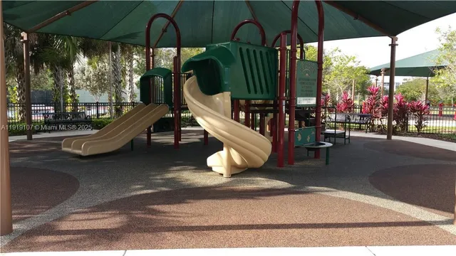 a view of a roof deck with table and chairs