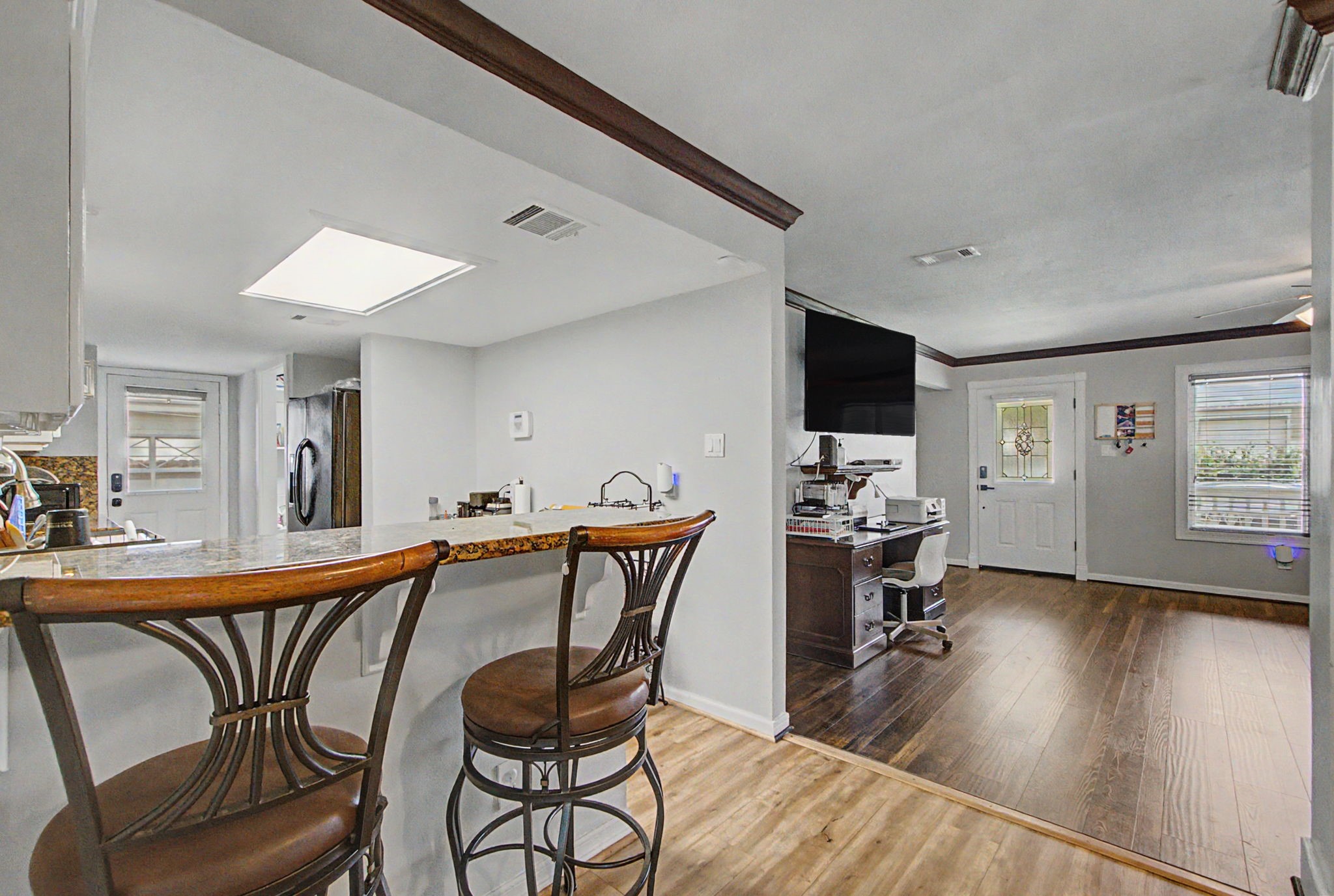 10034 Alfred Lane Houston, TX 77041 - Photo 15 of 50 The open layout creates a natural connection between the kitchen and living areas, making everyday living feel effortless.