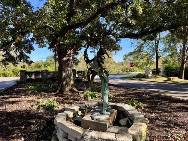 a view of a field with trees in the background