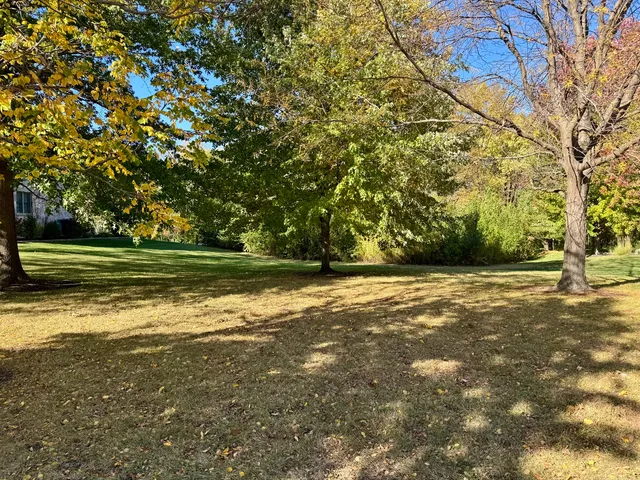 a view of a swimming pool with an outdoor space and seating area