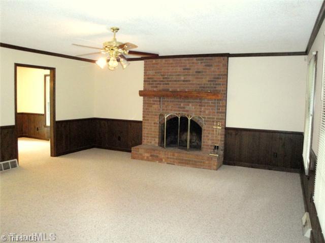 398 Farmstead Road Winston-Salem, NC 27107 - Photo 4 of 16 Living Room. The gracious Living Room has paneled wainscoting and brick wood burning fireplace!
