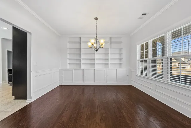 a kitchen with granite countertop a refrigerator and a stove