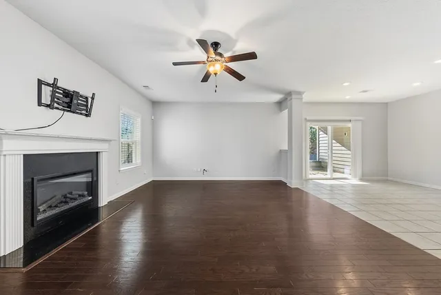 a view of livingroom with hardwood floor and kitchen view